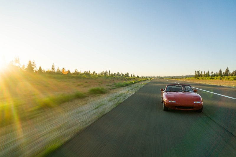 red mazda convertible car driving on empty highway with on sunny day, red mazda convertible driving on empty highway 4k