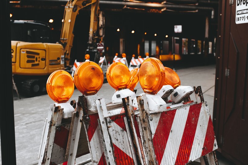 red and white barricades near a construction site in chicago, construction site barricades 4k