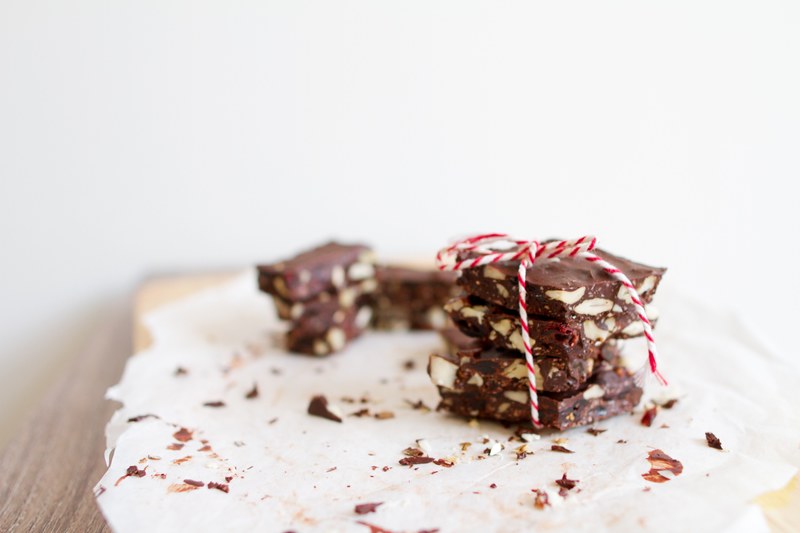 peppermint nut chocolate bark tied together with red and white bakers twine, diy christmas chocolates 4k
