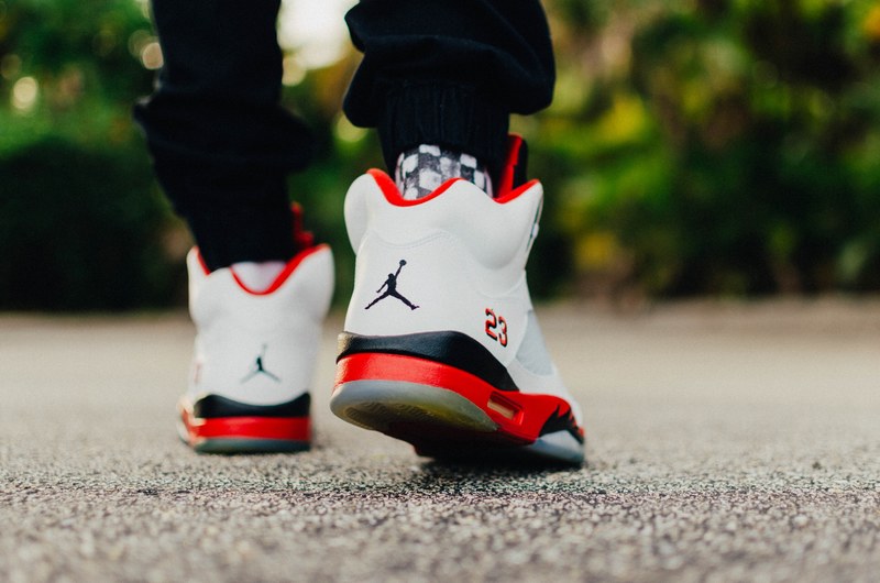 a close up shot of the back of a running mans air jordan shoes, running in air jordans 4k