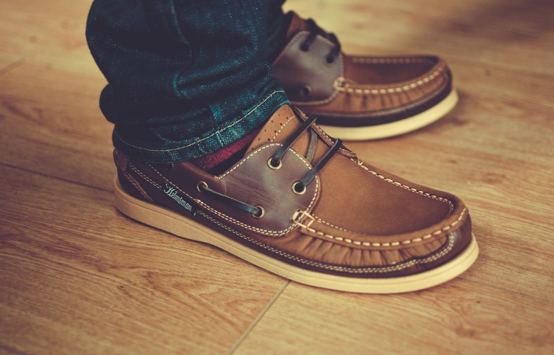 a close up shot of brown mens loafers on a males feet, man wearing loafers 4k