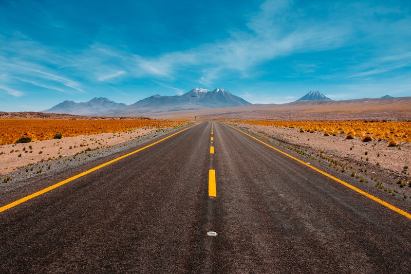 staring down a desert road with passing allowed from either lane, desert road drive 4k