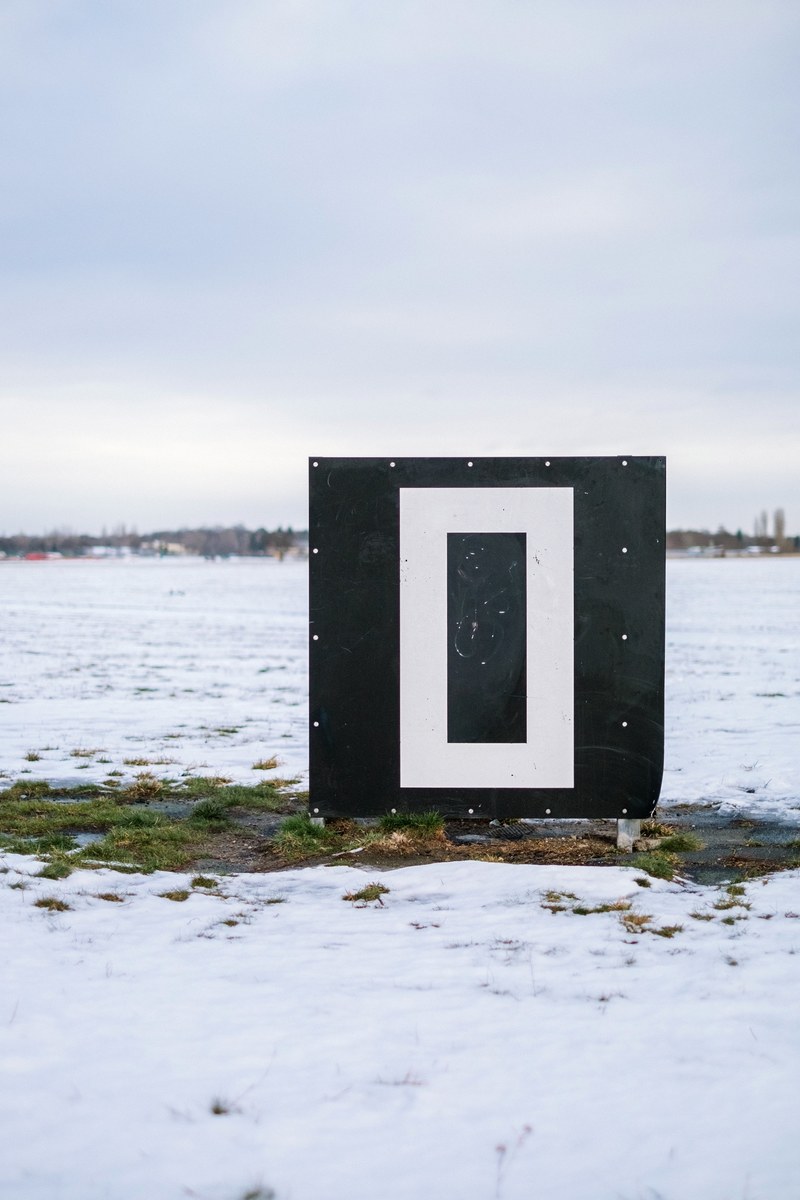 a small building surrounded by snow at the germany airport runway berlin tempelhofer airport, airport in germany 4k