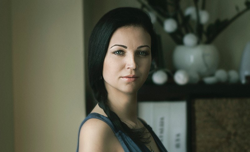 woman with a side brain and looks content in her home, aksana 4k