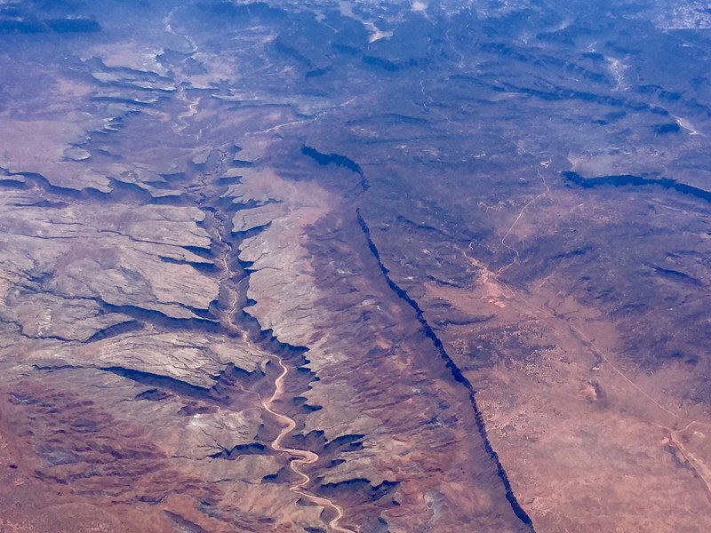 an aerial drone shot of a rocky ravine and soil in lake powell utah, lake powell drone shot 4k