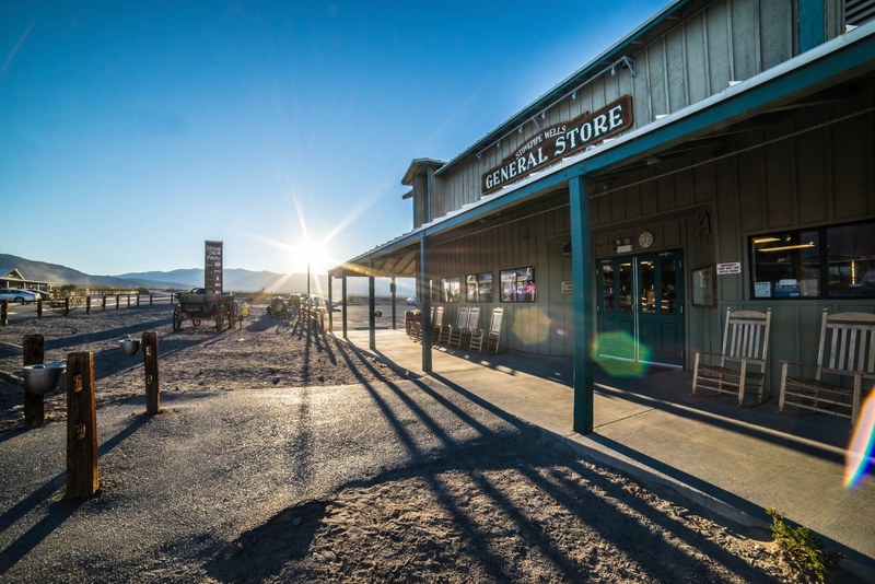 a general store in a remote location in the mountains, the old west 4k