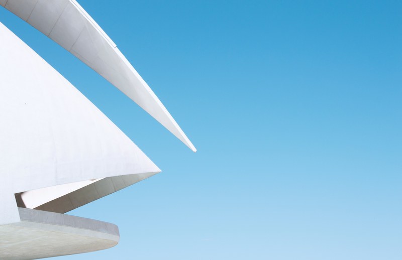 clear blue sky and modern abstract architecture design at ciudad de las artes y las ciencias, white architecture next to sky 4k