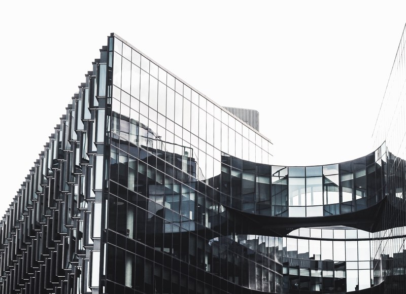 the glass facade of a modern office building in london, glass wall 4k