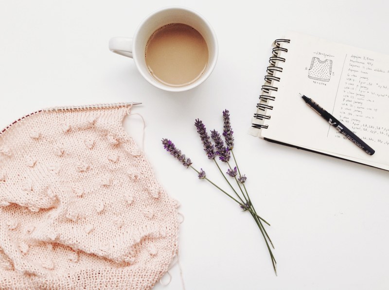 a bunch of lavender flowers next to a cup of coffee and a notepad on a white surface, coffee amp knit 4k