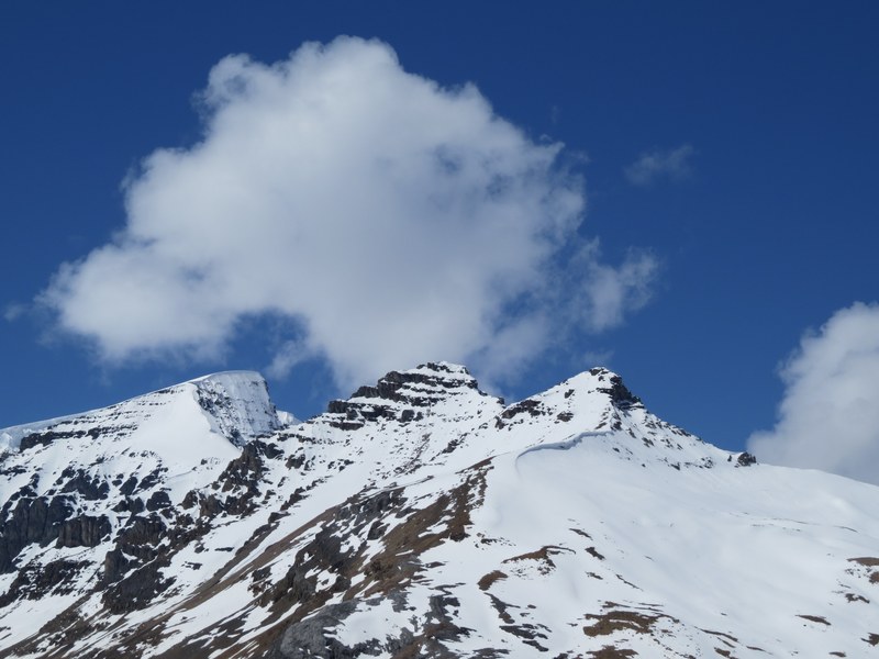 clouds over a snowy mountain peaks at banff national park, snowy mountains banff national park 4k
