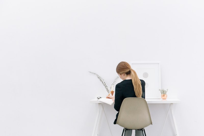 a long haired woman sitting at a computer desk, _woman working at desk 4k