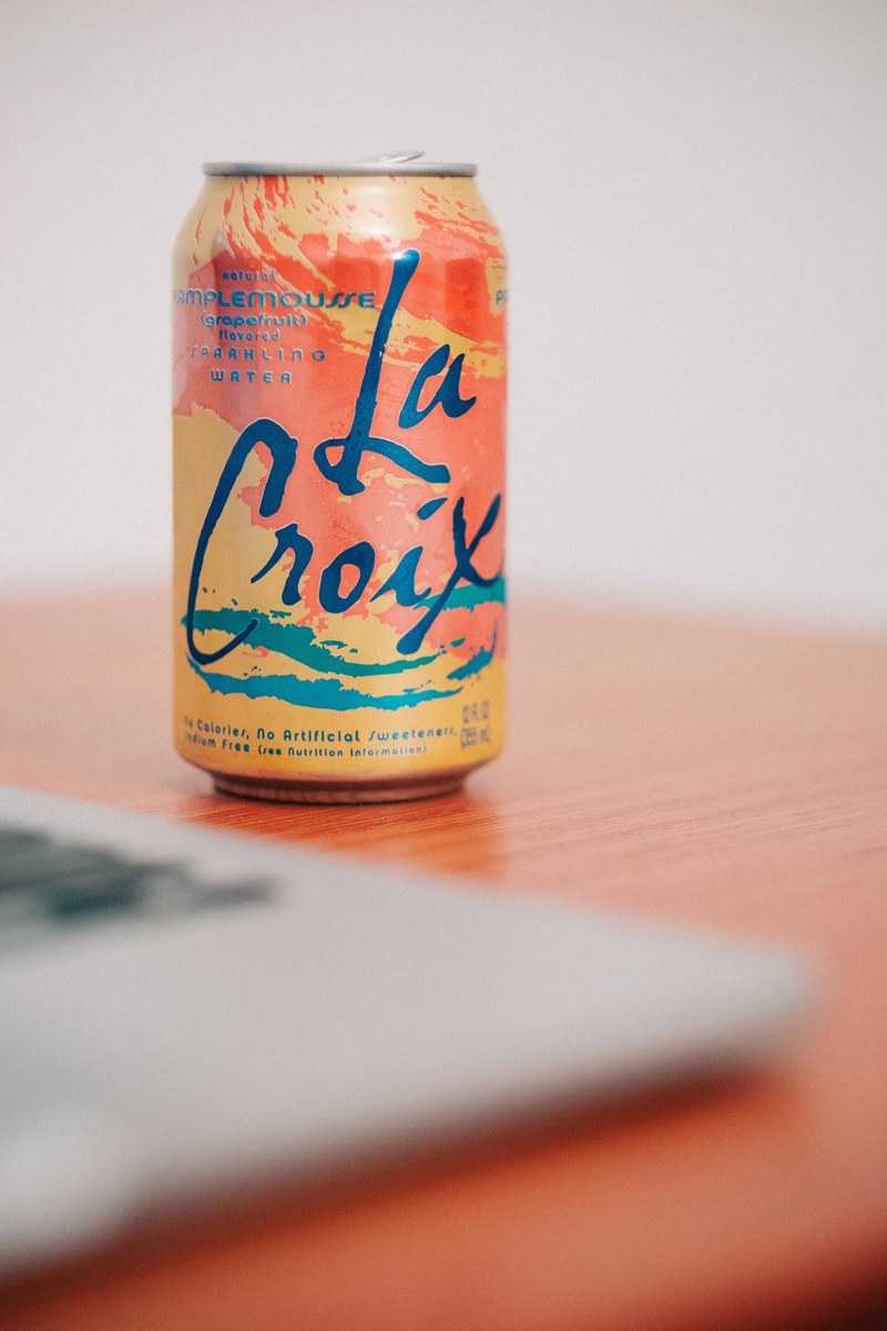 orange la croix on a table in brightly lit room, la croix in the summer 4k