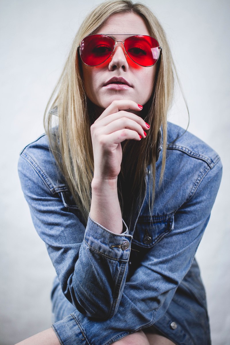 woman poses in trendy red sunglasses and a blue denim jacket, woman in pink sunglasses 4k