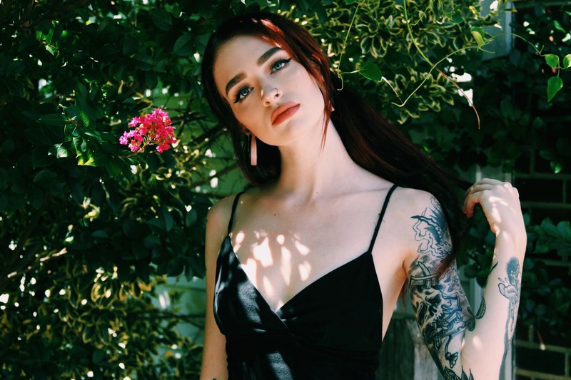 woman standing in foliage fashion and portrait 4k