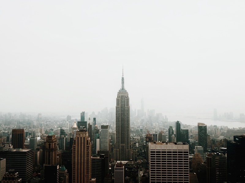 the empire state building and new york city skyline on a foggy day, new york 4k