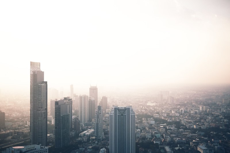 the skyline of bangkok shrouded in mist, misty bangkok skyline 4k