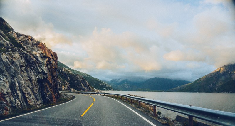 driving on a mountain highway road near the water, the road to eternity 4k