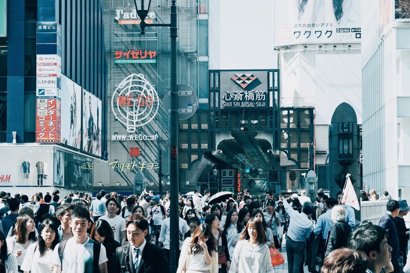 people in business attire in a crowded street in japan, holiday shopping street 4k