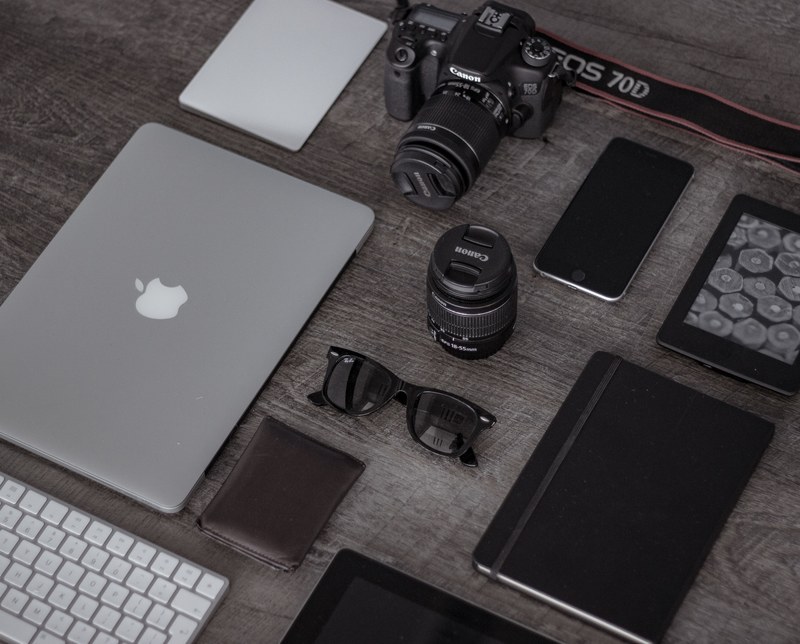 a flatlay with a long lens camera a macbook an iphone a kindle and a notebook, laptop camera phone notebook 4k