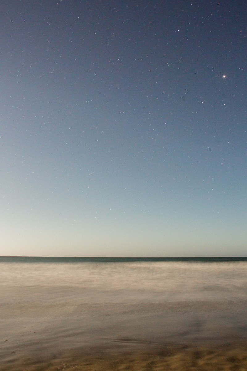 long exposure photo of the ocean beneath the starry sky at stinson beach, ocean under starry sky 4k