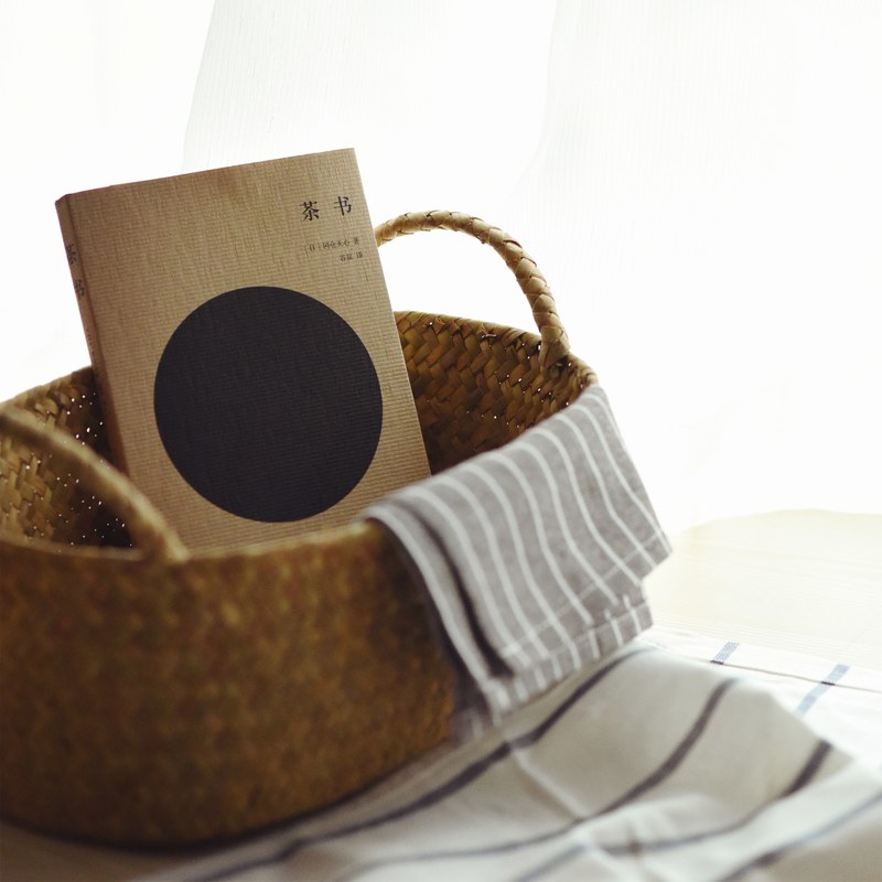 a notebook in a wicker basket in a bright room, notebook in a basket 4k