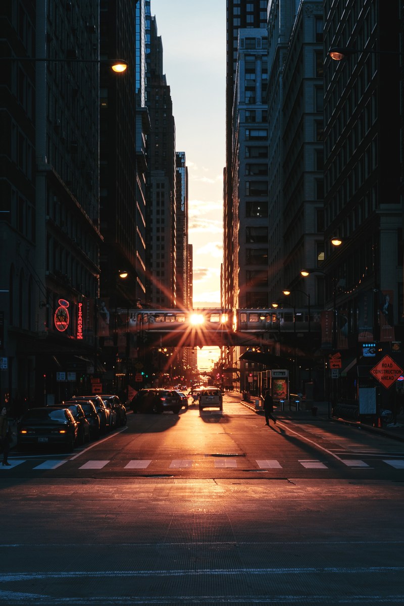 sunset over a street in downtown chicago, caught a moment 4k