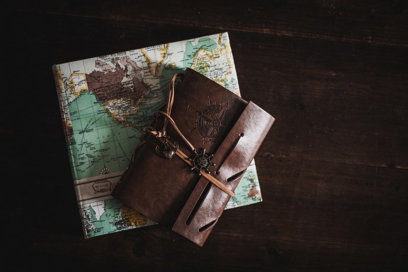 a leather journal and a travel diary as seen in cologne, _leather journal travel cologne 4k
