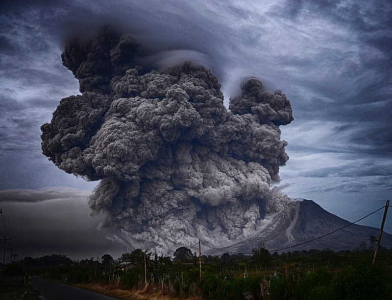 a tall cloud of volcanic ash rising up from a slope of mount sinabung, volcano ash cloud 4k