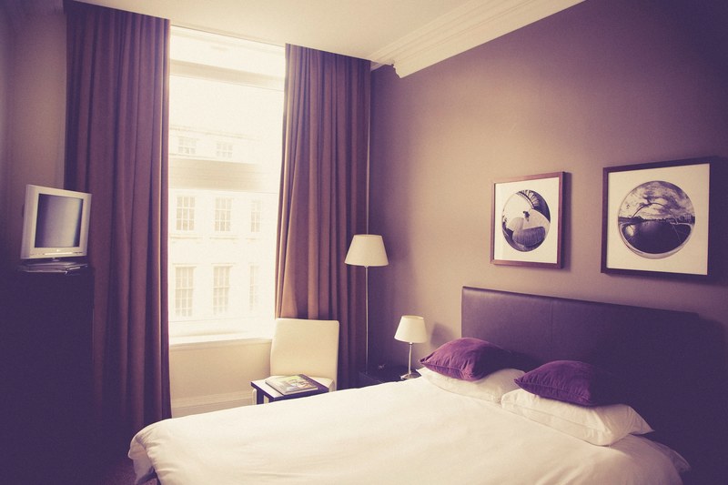 hotel bedroom with bed pictures on dark walls and window with curtains in daytime, hotel bedroom windows 4k