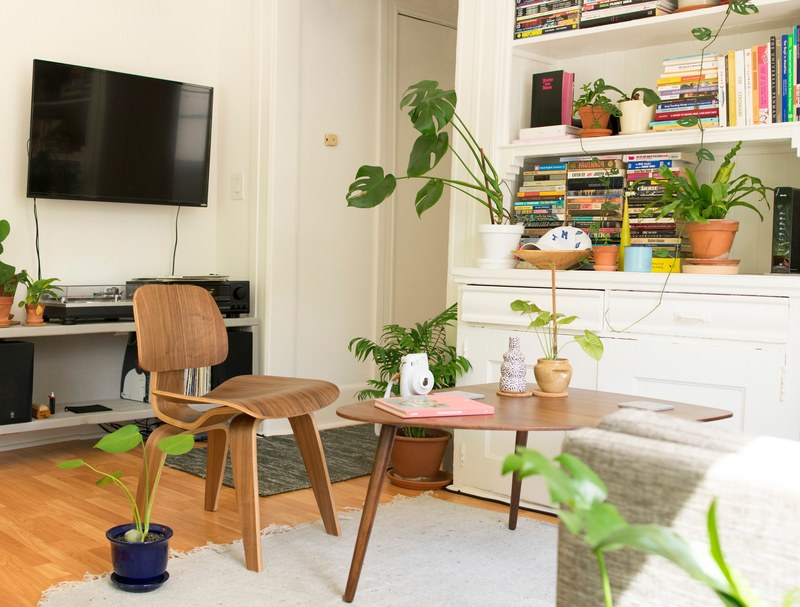 modern living room with wooden furniture plants on the floor a tv on the wall and bookshelves in the background, i love my room pt 1 4k