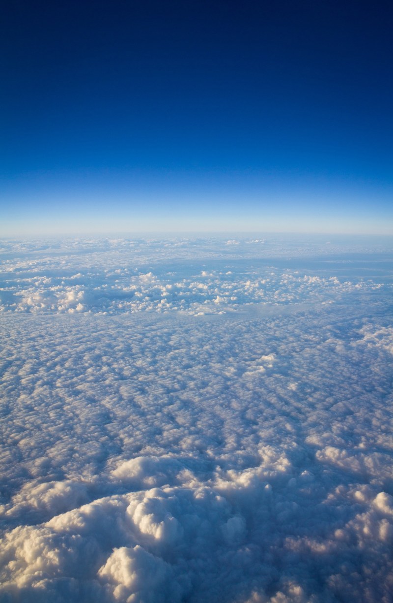 aeriel view of clouds with blue sky in the distance, aeriel view clouds 4k