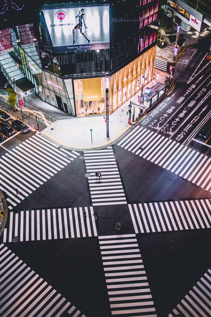 a shot from above the intersecting crosswalk in ginza at night, _on our way to tsukiji fish market in tokyo 4k
