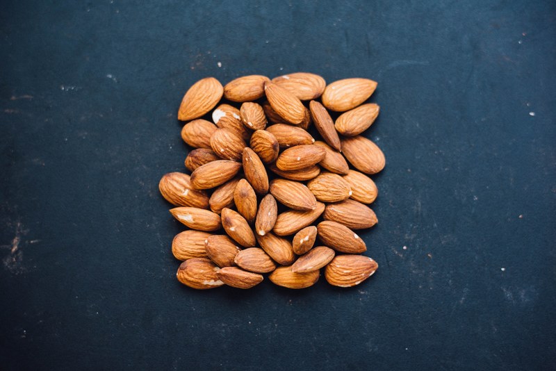 nuts almonds table and black 4k