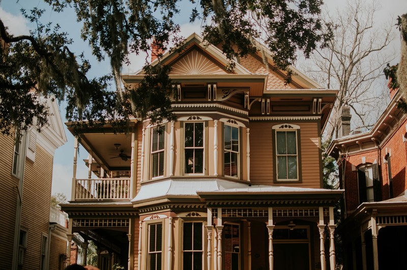 a beautiful house with a porch in a residential neighborhood in the heart of savannah georgia, _savannah georgia 4k