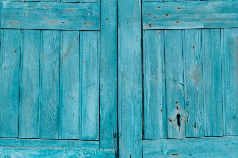 a blue wooden door texture background taken in malfa sicily italy, indigo washed memories of salina 4k