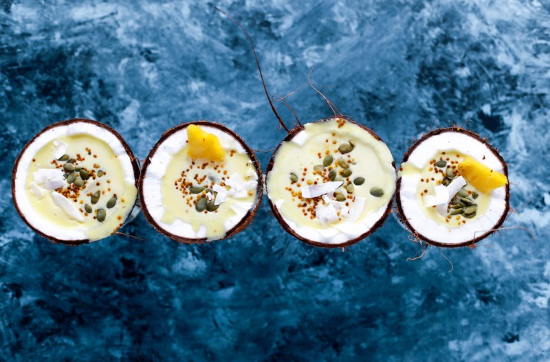 pina colada served in coconuts 4k