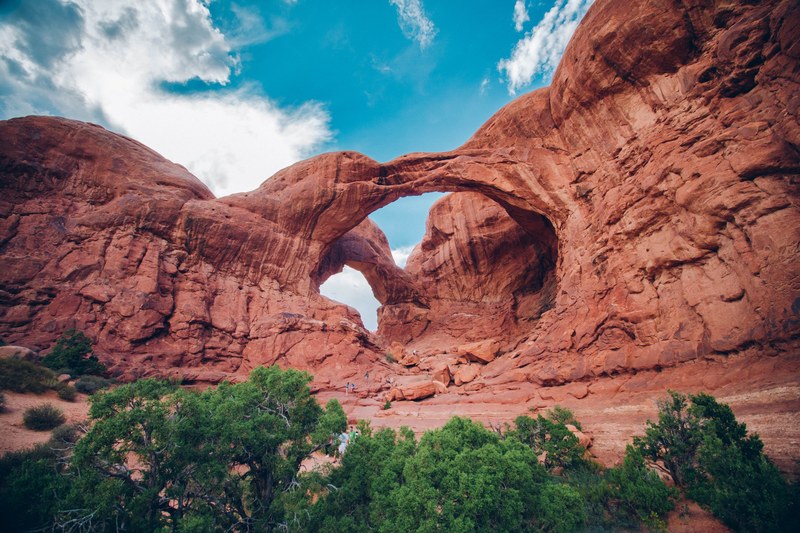 orange sandstone formations in arches national park, natural desert archway 4k