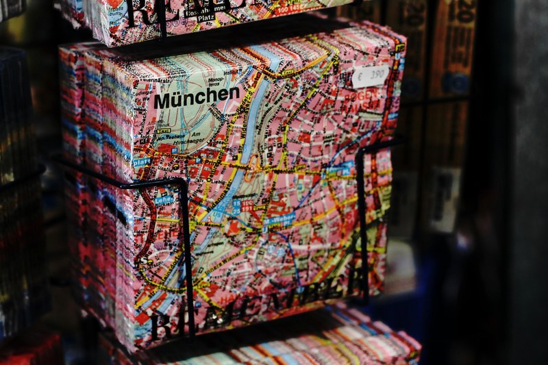 a pack of napkins with the map of munich printed on them in a souvenir store, napkin map 4k