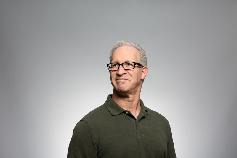 a smiling gray haired man in glasses and a green polo shirt, gray haired man portrait 4k