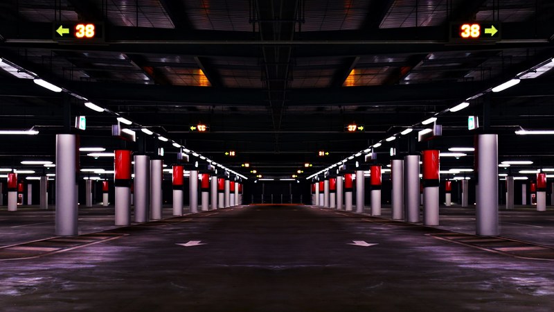 columns form patterns and lines in an underground parking structure, industrial parking lot 4k
