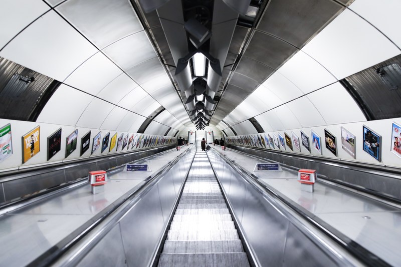 a long escalator in the london underground, entering the london underground 4k