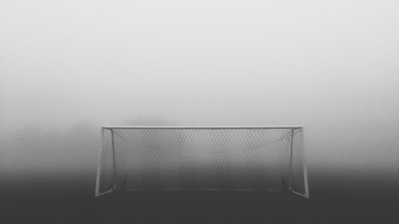 soccer goal construction with the net in the fog, a day in the fog 4k