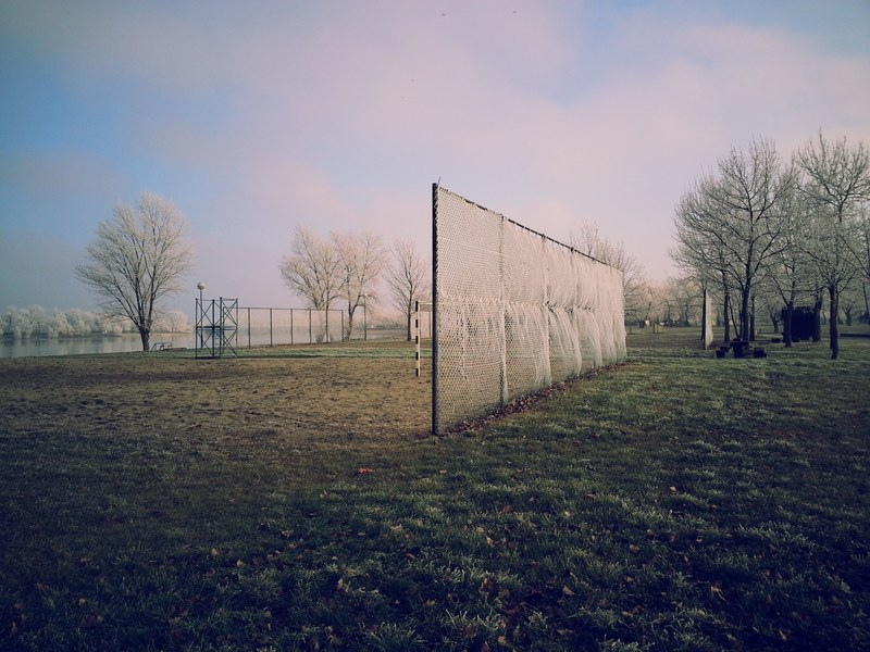 nets line an empty soccer field in the winter, soccer field 4k