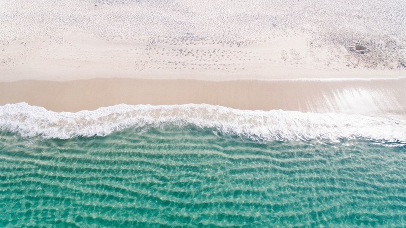 drone view of ocean waves washing on the sand beach at nelson bay, ocean waves drone view 4k
