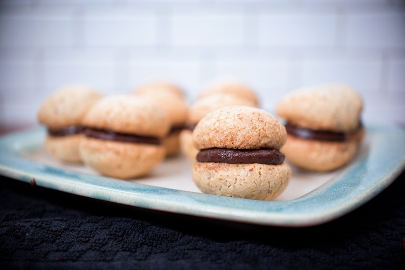 small plate of chocolate fresh macaron pastries, french pastries 4k