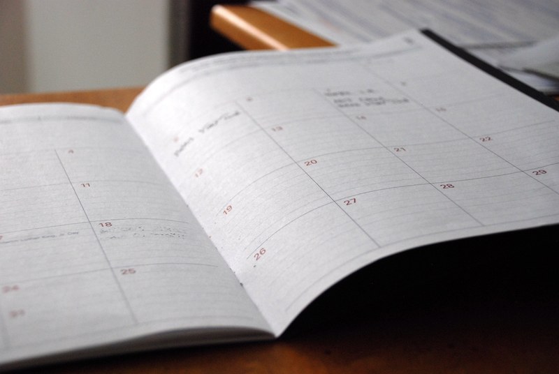 an open calendar with short notes scribbled next to the dates, monthly schedule 4k