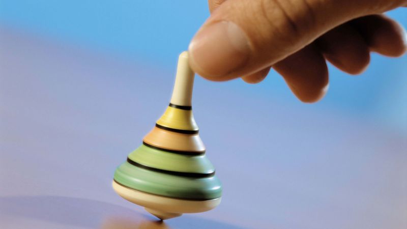hand, spinning top, toy, blue background, 4k