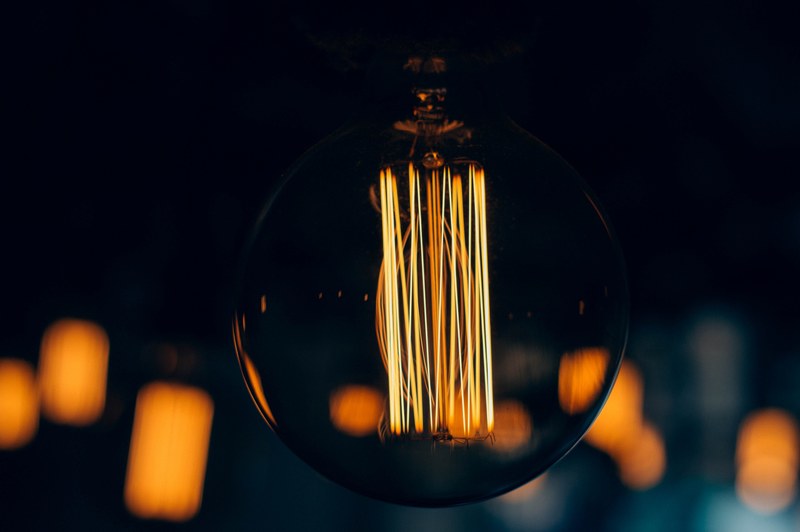 burning filament in a round light bulb, dream bulb 4k