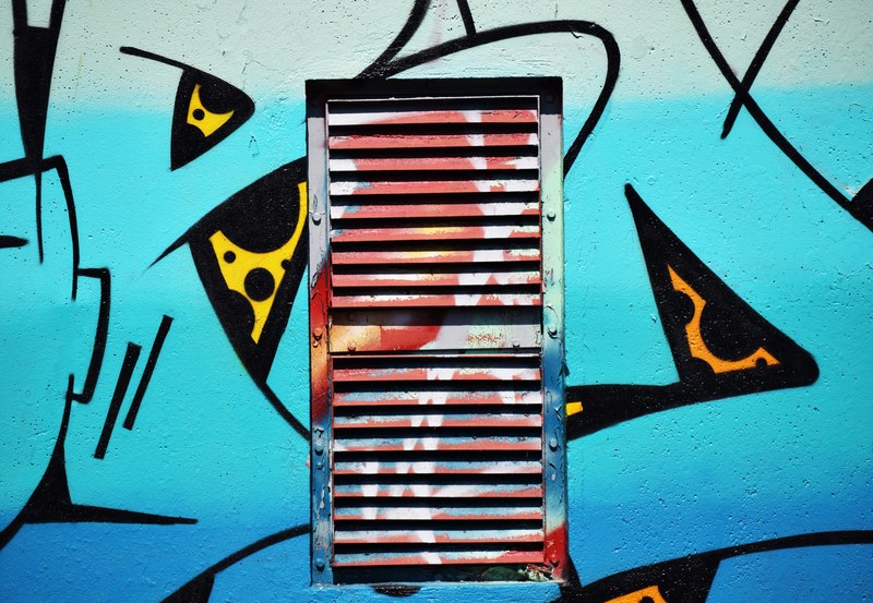 colorful sky blue urban graffiti over window shutter, blue wall with shutter 4k