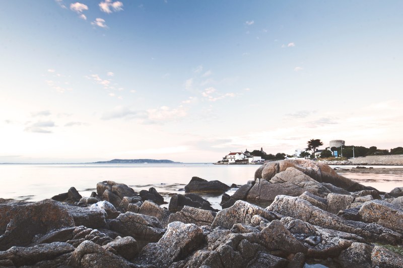 coastal houses viewed from a rocky shore at dn laoghaire, rocky shore 4k